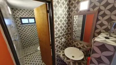 a small bathroom with a toilet and a sink at La Moradita Villa Carlos Paz in Villa Carlos Paz