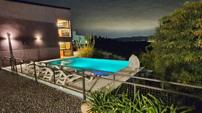 a swimming pool on the balcony of a house at La Moradita Villa Carlos Paz in Villa Carlos Paz