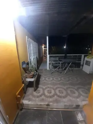 a view of a balcony of a house at night at Monoambiente Cerro in Villa Carlos Paz
