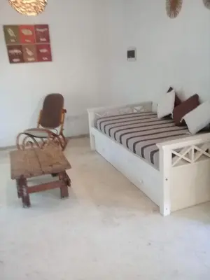 a bedroom with a bed and a chair at Cielito lindo in San Javier