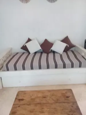 a couch with pillows on it in a room at Cielito lindo in San Javier