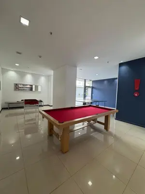 a large room with a ping pong table in it at Departamento moderno y lujoso con gym y piscina in Cordoba