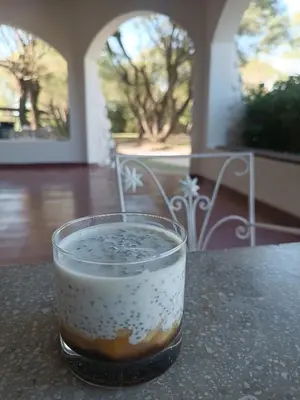 a drink in a glass sitting on a table at Hotel del Alto in Nono