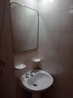 a bathroom with a sink and a mirror at Champ Cervi in San Antonio de Arredondo