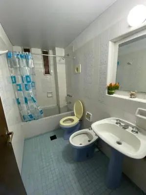 a bathroom with a toilet and a sink at Departamento Villa Carlos Paz in Villa Carlos Paz