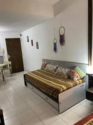 a large bed in a room with at Departamento Villa Carlos Paz in Villa Carlos Paz