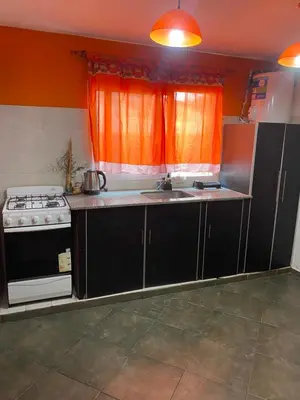 a kitchen with a stove and a sink at alquiler temporario en Mina Clavero in Mina Clavero