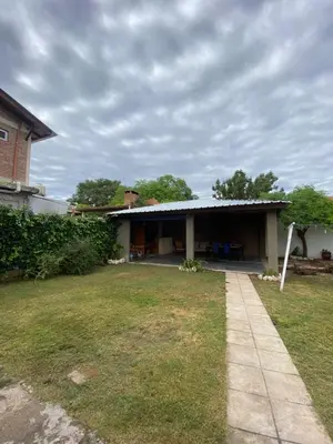 a house with a lawn in front of it at alquiler temporario en Mina Clavero in Mina Clavero