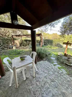 a table and two chairs on a patio at Auken Penkoken in Merlo