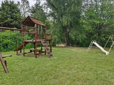 an empty playground with a slide and a swing set at Lo de Juan in Villa General Belgrano