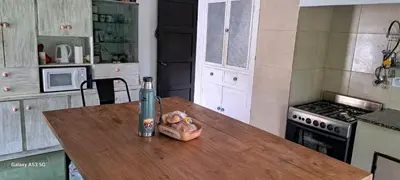 a table in a kitchen with a can on it at Casa de campo EL LULI in La Bolsa