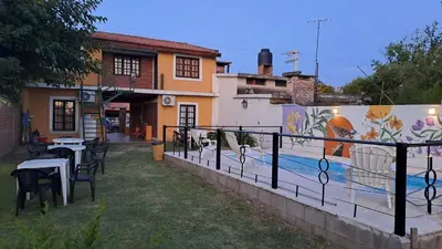 a house with a mural on the side of it at Complejo NONA RITA in Villa Cura Brochero