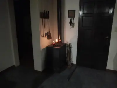 a room with a black door and a table with candles at Casa con piscina en entorno muy verde in Villa Anizacate