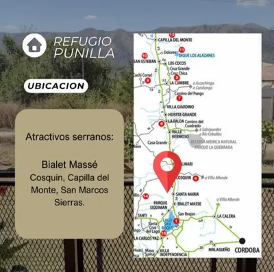 a sign next to a fence with a map at Casa REFUGIO PUNILLA in Cordoba