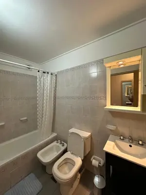 a bathroom with a toilet and a sink at Departamento alquiler temporal 6 D INVERHOME INMOBILIARIA in Cordoba