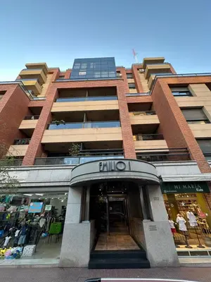 a tallartment building with a store in front of it at Departamento alquiler temporal 6 D INVERHOME INMOBILIARIA in Cordoba