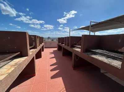 a row of beds on the roof of a building at Departamento 2 dormitorios excelente ubicacion in Villa Carlos Paz