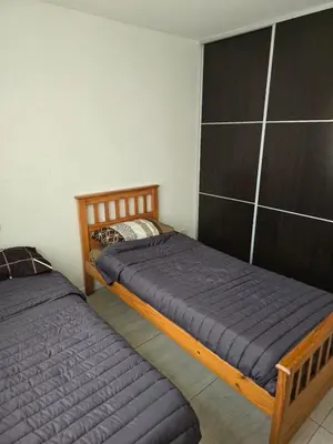a bedroom with two twin beds in it at Departamento 2 dormitorios excelente ubicacion in Villa Carlos Paz