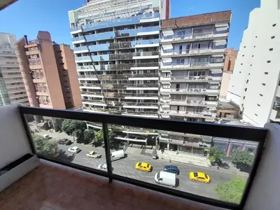 a view from a window of a city street with cars at Osveli in Cordoba