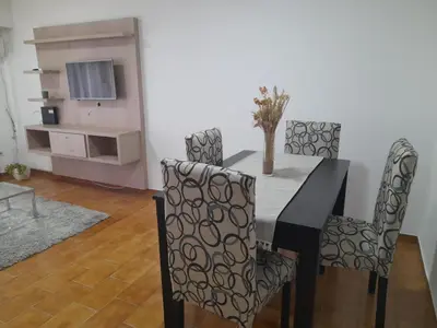 a dining room with a black table and chairs at Osveli in Cordoba