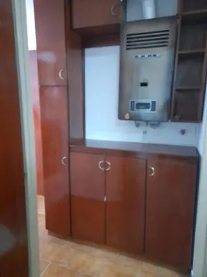 a kitchen with a microwave and a tv on a cabinet at Osveli in Cordoba