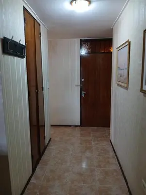 an empty hallway with two doors and a tile floor at Adrimar Cordoba Centro in Cordoba