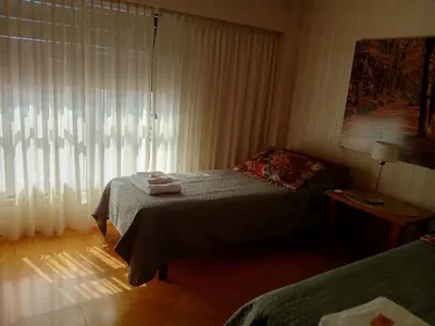 a small bedroom with a bed and a window at Adrimar Cordoba Centro in Cordoba