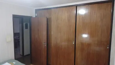 a room with two wooden cabinets in a room at Adrimar Cordoba Centro in Cordoba