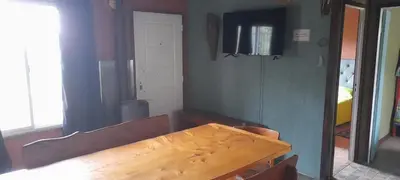 a wooden table in a room with a mirror at Cabaña LA LUGARDA in Cuesta Blanca