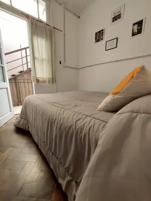 a large bed in a room with a window at WHY NOT NUEVA CORDOBA in Cordoba