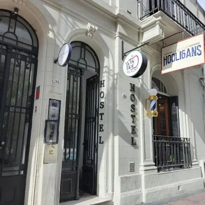 a white building with a sign on the side of it at WHY NOT NUEVA CORDOBA in Cordoba