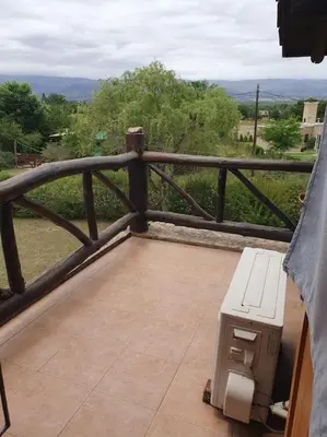 a bench sitting on a balcony with a view at La Traviata in Mina Clavero