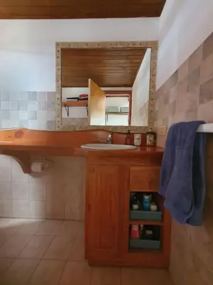 a bathroom with a sink and a mirror at La Traviata in Mina Clavero