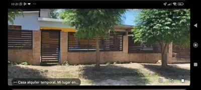 a building with two trees in front of it at Tu lugar in San Antonio de Arredondo