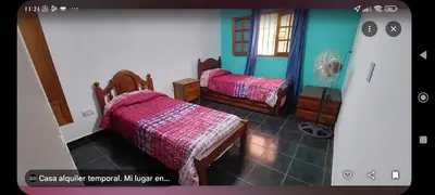 a room with two beds in a room at Tu lugar in San Antonio de Arredondo