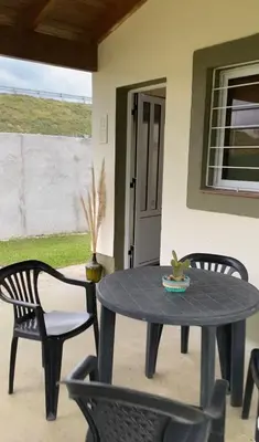 a black table and chairs on a patio at San Roque in San Roque