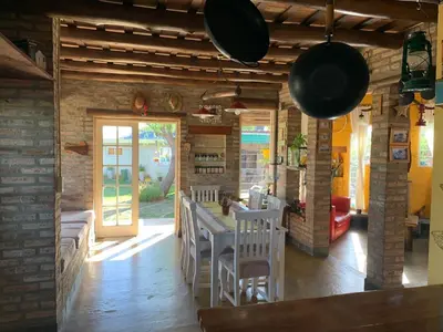 a kitchen with a table and some pots and pans at Estacion Potrero cabaña grande in Potrero de Garay