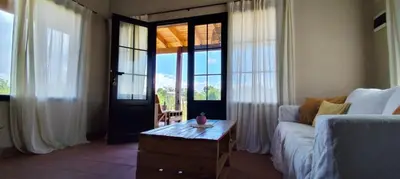 a living room with a couch and a coffee table at Alebrijescalamuchita in Villa Ciudad Parque