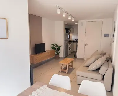 a living room with a couch and a table at Apartamento Obispo Trejo, Nueva Cordoba in Cordoba