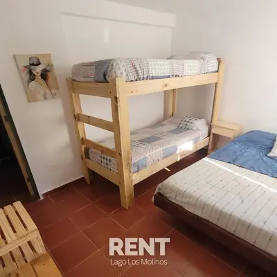 a room with two bunk beds and a bed at 
