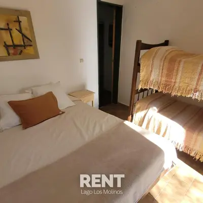 a small bedroom with a bed and a bedskirts at 