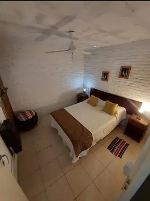 a bedroom with a bed and a ceiling at Pasión Serrana in Las Calles