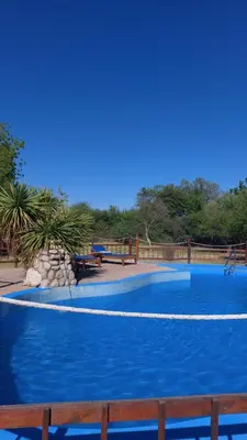 a large swimming pool with blue water at Pasión Serrana in Las Calles