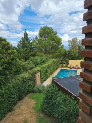 a backyard with a pool and a tennis court at INCA HUASI - Cabañas de Altura in El Rincón