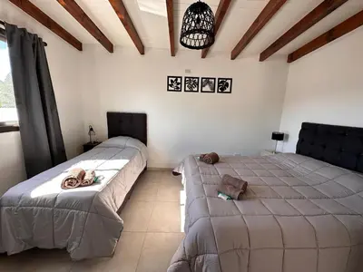 a bedroom with two beds in a room at Complejo Montana Departamento 3 in Potrero de Garay