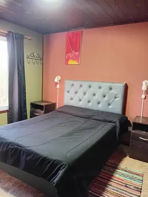 a bedroom with a large bed in a room at La Lugarda in Cuesta Blanca