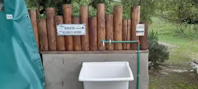 a toilet in front of a wooden fence at La Lugarda in Cuesta Blanca