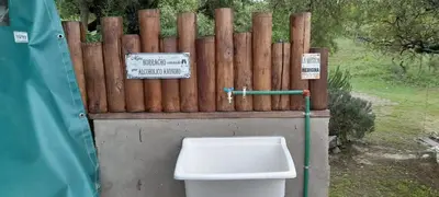 a toilet in front of a wooden fence at La Lugarda in Cuesta Blanca