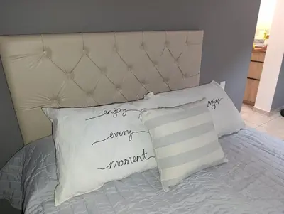 a bed with two white pillows on it at Potrero Loft in Potrero de Garay