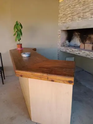 a counter in a room with a fireplace at Dúplex, Alejandría in Villa Carlos Paz